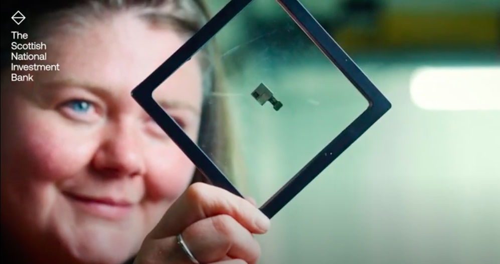 Woman looking at data chip